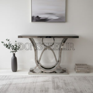 میز کنسول استیل نقره ای مدل سه خط با رویه شیشه مشکی قرار گرفته در دکوراسیون مدرن